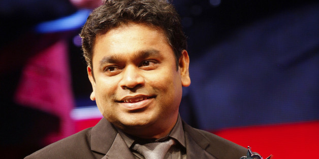 Indian artist AR Rahman smiles as he receives the award for Outstanding Achievement inn Music at The Asian Awards at Grosvenor House Hotel, Park Lane, London, on Tuesday, Oct. 26, 2010. (AP Photo/Paul Jeffers)