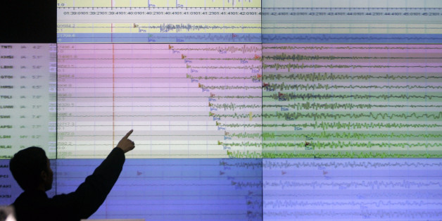 A geologist looks at a screen showing the seismograph reading of the powerful earthquake that rocked Sumatra island at the office of Indonesia's meteorological agency in Jakarta, Indonesia, Wednesday, Sept. 30, 2009. The U.S. Geological Survey said the quake had a preliminary magnitude of 7.9, and struck 30 miles (50 kilometers) off the coast of Sumatra. (AP Photo/Irwin Fedriansyah)