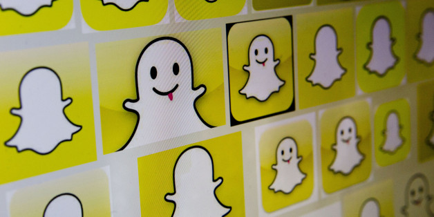 Snapchat Inc. logos are displayed on a laptop computer in Washington, D.C., U.S., on Wednesday, Feb. 18, 2015. Snapchat Inc. is raising money that could value the company at as much as $19 billion. Photographer: Andrew Harrer/Bloomberg via Getty Images