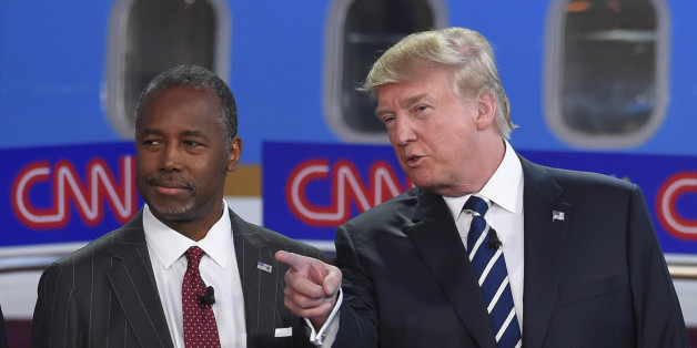 Republican presidential candidates Ben Carson, left, and Donald Trump talk before the start of the CNN Republican presidential debate at the Ronald Reagan Presidential Library and Museum on Wednesday, Sept. 16, 2015, in Simi Valley, Calif. (AP Photo/Mark J. Terrill)