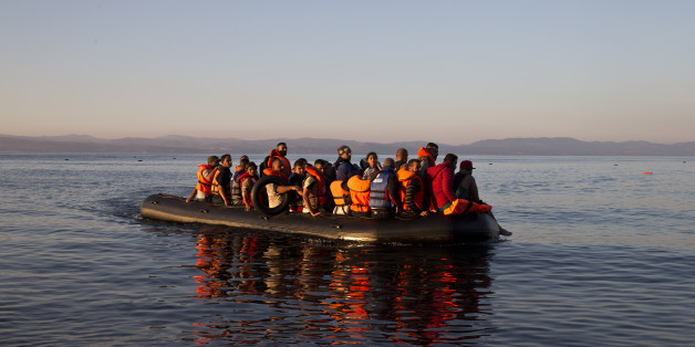 Syrian refugees arrive aboard a dinghy after crossing from Turkey, to the island of Lesbos, Greece. Friday, Sept. 18, 2015. More than 250,000 people have reached Greece clandestinely so far this year, the vast majority of them Syrians or Afghans fleeing conflict at home. (AP Photo/Petros Giannakouris)