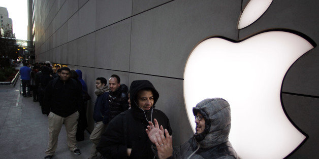 A line of people waiting to purchase the new Apple iPad mini snake around the side of the Apple store on Michigan Ave. Friday, Nov. 2, 2012 in Chicago. Apple's new 7.9 inch tablet went on sale at 8:00 A.M. CDT at the store. (AP Photo/M. Spencer Green)