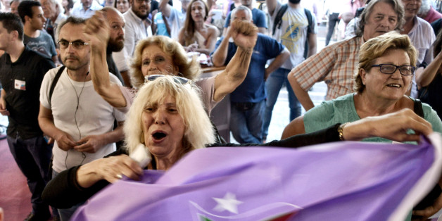 ATHENS, GREECE - SEPTEMBER 20: Supporters of radical leftist Syriza party Alexis Tsipras cheer at exit poll results on September 20, 2015 in Athens, Greece. In Greece's fifth general election in six years, the latest polls have the incumbent Syriza party with a slight lead over the New Democracy. A new bailout of $96 million was approved for Greece in August. (Photo by Milos Bicanski/Getty Images)