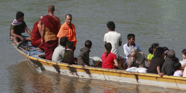 A boat carrying last batch of Myanmar refugees back home cruises on the Moei river in Mae Sot, Thailand Wednesday, Nov. 10, 2010. Clashes starting Sunday between ethnic rebels and government troops prompted an exodus of about 20,000 refugees across the border in to Thailand. Many of them headed home Tuesday after the fighting at the Thai-Myanmar border town of Myawaddy subsided. But about 1,000 still remained on Thai soil opposite the Three Pagoda Pass, another site of clashes in recent days. (A