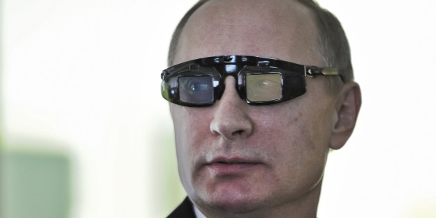 Russian President Vladimir Putin wears special glasses as he visits a research facility of the St. Petersburg State University in St. Petersburg, Russia, on Monday, Jan. 26, 2015. In televised comments after a meeting with students in St. Petersburg, President Vladimir Putin said that Ukraineâs army was at fault for the increase in violence and accused it of using civilians as âcannon fodderâ in the conflict. â(Ukraineâs army) is not even an army, itâs a foreign leg