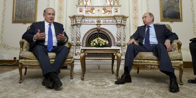 Russian President Vladimir Putin listens to Israeli Prime Minister Benjamin Netanyahu, left, during their meeting in the Novo-Ogaryovo residence, outside Moscow, Russia, Monday, Sept. 21, 2015. (AP Photo/Ivan Sekretarev, Pool)