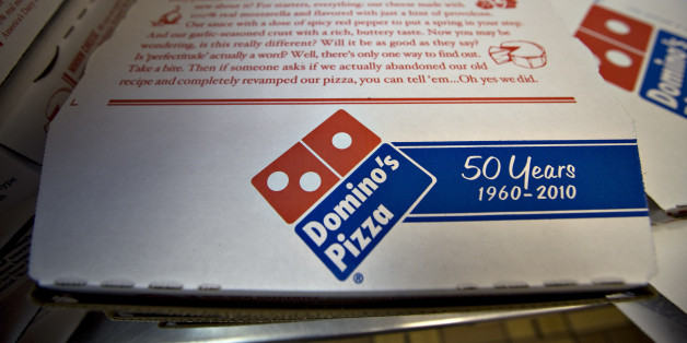 Pizza boxes sit inside a Domino's Pizza franchise on 89th Street in New York, U.S., on Wednesday, Jan. 13, 2010. Domino's Pizza Inc., the second-largest U.S. pizza maker, said Internet orders make up the fastest-growing part of its business, accounting for as much as 30 percent of sales in some markets. Photographer: Daniel Acker/Bloomberg via Getty Images