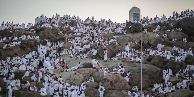 Muslim pilgrims pray on a rocky hill called the Mountain of Mercy, on the Plain of Arafat, near the holy city of Mecca, Saudi Arabia, Wednesday, Sept. 23, 2015 during the hajj pilgrimage. Mount Arafat, marked by a white pillar, is where Islam's Prophet Muhammad is believed to have delivered his last sermon to tens of thousands of followers some 1,400 years ago, calling on Muslims to unite. (AP Photo/Mosa'ab Elshamy)