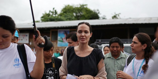 US actress and UNHCR Goodwill Ambassador Angelina Jolie (C) visits Jan Mai Kaung refugee camp in Myitkyina, Kachin State in Myanmar on July 30, 2015. Jolie flew into Myanmar for a humanitarian visit, becoming the latest in a growing list of celebrities who have travelled to the former junta-run nation. AFP PHOTO / Hkun Latt (Photo credit should read HKUN LATT/AFP/Getty Images)