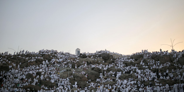 Muslim pilgrims pray on a rocky hill called the Mountain of Mercy, on the Plain of Arafat, near the holy city of Mecca, Saudi Arabia, Wednesday, Sept. 23, 2015 during the hajj pilgrimage. Mount Arafat, marked by a white pillar, is where Islam's Prophet Muhammad is believed to have delivered his last sermon to tens of thousands of followers some 1,400 years ago, calling on Muslims to unite. (AP Photo/Mosa'ab Elshamy)