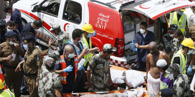 Emergency services attend to victims crushed in a crowd in Mina, Saudi Arabia during the annual hajj pilgrimage on Thursday, Sept. 24, 2015. Hundreds were killed and injured, Saudi authorities said. The crush happened in Mina, a large valley about five kilometers (three miles) from the holy city of Mecca that has been the site of hajj stampedes in years past. (AP Photo)