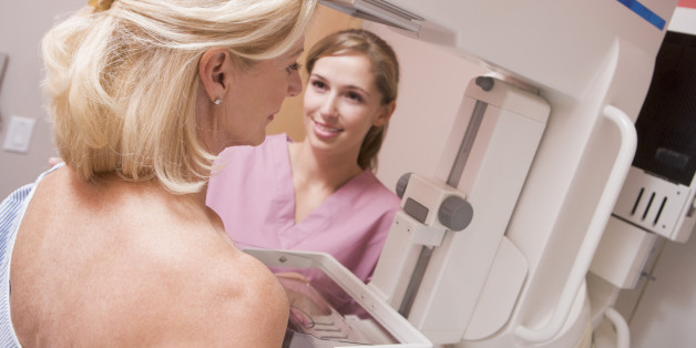 Nurse Assisting Patient Undergoing Mammogram