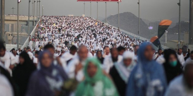 Hundreds of thousands of Muslim pilgrims make their way to cast stones at a pillar symbolizing the stoning of Satan, in a ritual called "Jamarat," the last rite of the annual hajj, on the first day of Eid al-Adha, in Mina near the holy city of Mecca, Saudi Arabia, Thursday, Sept. 24, 2015. (AP Photo/Mosa'ab Elshamy)