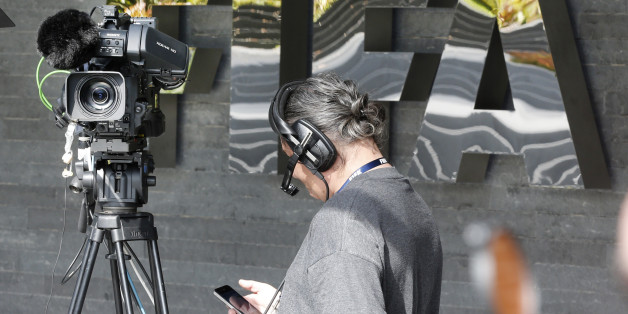 A camera man waits for a press conference with FIFA-President Sepp Blatter on the occasion of a meeting of the FIFA Executive Committee in Zurich, Switzerland, Friday, Sept. 25, 2015. FIFA canceled a news conference scheduled with President Sepp Blatter without explanation, fueling the sense of turmoil surrounding footballâs embattled governing body. (AP Photo/Michael Probst)