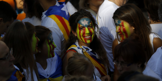 Young girls with their face painted with a pro-independence Catalan flag, known as the Estelada flag, gather with others during a rally calling for the independence of Catalonia, in Barcelona, Spain, Friday, Sept. 11, 2015. Advocates of independence for Spain's northeastern region of Catalonia on Friday launched their campaign to try to elect a majority of secessionists in regional parliamentary elections on Sept. 27. (AP Photo/Francisco Seco)