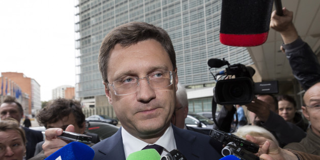 Russia's Energy Minister Alexander Novak, center, speaks with the media as he arrives in front of EU headquarters in Brussels on Friday, Sept. 25, 2015. Russia and Ukraine resumed talks on Friday in Brussels, aimed at trying to clinch a deal guaranteeing that Ukraine will receive shipments of Russian natural gas this winter. (AP Photo/Thierry Monasse)
