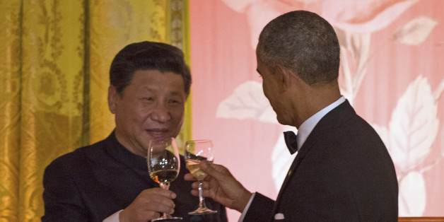 President Barack Obama and Chinese President Xi Jinping arrive for their joint news conference, Friday, Sept. 25, 2015, in the Rose Garden at the White House in Washington. (AP Photo/Evan Vucci)