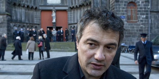 French doctor and contributor to French satirical magazine Charlie Hebdo, Patrick Pelloux, speaks to journalists in Clermont-Ferrand on January 14, 2015, after attending the funeral of Michel Renaud, who died on January 7 in the attack at the magazine's offices in Paris. Renaud was in attendance at the magazine's weekly editorial conference after returning cartoons given to him on loan by the magazine for an exhibition in Clermont-Ferrand. AFP PHOTO / THIERRY ZOCCOLAN (Photo credit should read THIERRY ZOCCOLAN/AFP/Getty Images)