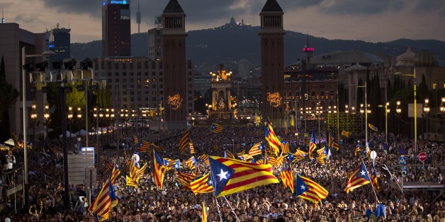Pro independence supporters wave "estelada" or pro independence flags during a rally of "Junts pel Si" or "Together for YES" in Barcelona, Spain, Friday, Sept. 25, 2015. Catalans vote Sunday in regional parliamentary elections that the breakaway camp hopes will give them a mandate to put their region on a path toward independence - a goal the Madrid central government says would be illegal. (AP Photo/Emilio Morenatti)