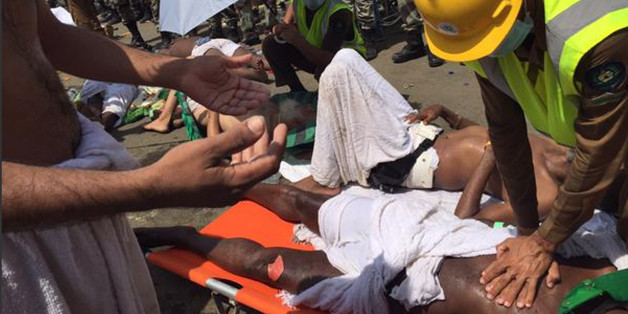 In this image posted on the official Twitter account of the directorate of the Saudi Civil Defense agency, a pilgrim is treated by a medic after a stampede that killed and injured pilgrims in the holy city of Mina during the annual hajj pilgrimage on Thursday, Sept. 24, 2015. (Directorate of the Saudi Civil Defense agency via AP) MANDATORY CREDIT