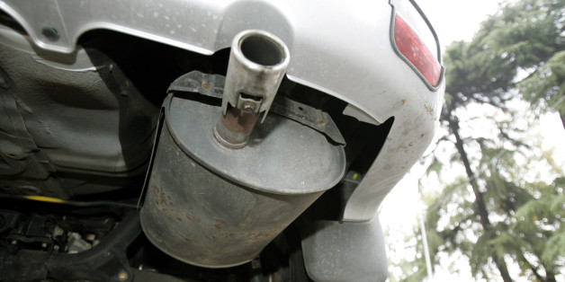 A suv (sport utility wagon) car is seen in downtown Milan, Friday, Oct. 8, 2004. Authorities are considering a new tax based on vehicles' fuel consumes, emissions, and their environmental impact. (AP Photo/Luca Bruno)