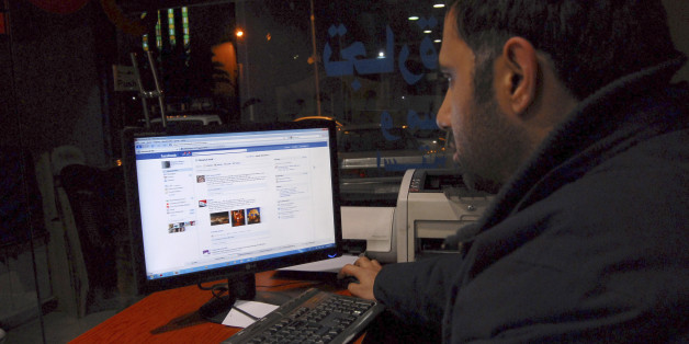 A Syrian man connects on his Facebook account at an internet cafe, in Damascus, Syria, on Tuesday Feb. 8, 2011. A media watchdog said Tuesday that Syria appears to be lifting a three-year-old ban on YouTube and Facebook, a decision that could be seen as a gesture to stave off unrest following popular uprisings in Egypt and Tunisia. The Syrian government does not comment on its Internet restrictions. But several Internet users in Syria told The Associated Press on Tuesday that the sites were accessible for the first time in years without having to tunnel through a proxy servers. Lifting the ban may well be an example of such reforms, but it is not a major concession by Assad. The ban had little practical effect, with many Syrians using proxy servers to access the sites every day. (AP Photo/Muzaffar Salman)