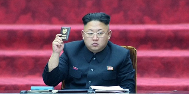 In this Wednesday, April 9, 2014 image made from video, North Korean leader Kim Jong Un holds up a parliament membership certificate during the Supreme People's Assembly in Pyongyang, North Korea. North Korea is declaring that the upcoming release of "The Interview," a comedy film about a plot to assassinate Kim Jong Un, would be an act of war. From over-the-top villainous roles in films such as "Olympus Has Fallen" and "Die Another Day" to madcap impersonations in series like "30 Rock" and "MAD