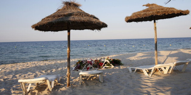 Lounge chairs and numerous flowers laid out at the scene of the attack in Sousse, Tunisia, Sunday, June 28, 2015. The Friday attack on tourists at a beach is expected to be a huge blow to Tunisia's tourism sector, which made up nearly 15 percent of the country's gross domestic product in 2014. (AP Photo/Abdeljalil Bounhar)