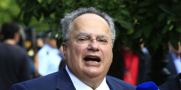 Greece's Foreign Minister Nikos Kotzias makes statements after a swearing in ceremony of the new cabinet in Athens, Wednesday, Sept. 23, 2015. Greece's new leftist-led coalition government has formally assumed its duties, pledging to enforce creditor-demanded spending cuts and reforms while softening the pain on an austerity-weary population. (AP Photo/Lefteris Pitarakis)