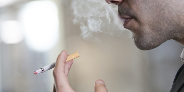 Man Smoking in Public Space