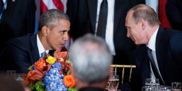President Barack Obama and Russian President President Vladimir Putin greet each other during a luncheon, Monday, Sept. 28, 2015, at United Nations headquarters. (AP Photo/Andrew Harnik)