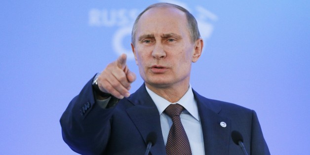 Russia's President Vladimir Putin speaks during a media conference after a G-20 summit in St. Petersburg, Russia on Friday, Sept. 6, 2013. World leaders discussed Syria's civil war at the summit but looked no closer to agreeing on international military intervention to stop it. (AP Photo/Alexander Zemlianichenko)