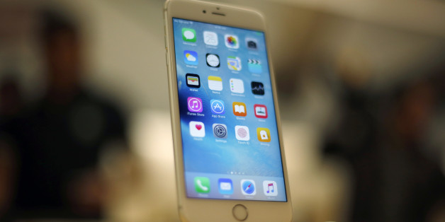 A new Apple iPhone 6S is displayed at an Apple store on Chicago's Magnificent Mile, Friday, Sept. 25, 2015, in Chicago. (AP Photo/Kiichiro Sato)