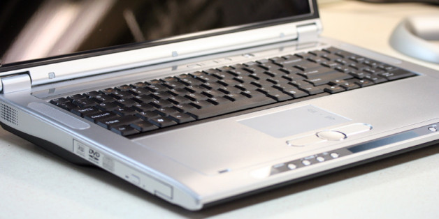 The DVD player can operate as a CD player while the system is shutdown. The buttons below the touchpad control the player.