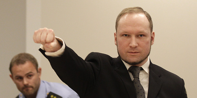 Mass murderer Anders Behring Breivik, makes a salute after arrives at the court room in a courthouse in Oslo Friday Aug. 24, 2012 . Breivik, who admitted killing 77 people in Norway last year, declared sane and sentenced to prison for bomb and gun attacks. (AP Photo/Frank Augstein)