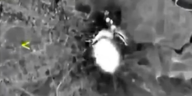 In this photo made from the footage taken from Russian Defense Ministry official web site on Thursday, Oct. 1, 2015 a bomb explosion is seen in Syria. Reacting to criticism that it is targeting opponents of the Syrian government, a spokesman for Russian President Vladimir Putin admitted on Thursday that Russia's airstrikes in Syria are targeting not only Islamic State militants but also other groups. (AP Photo/ Russian Defense Ministry Press Service)