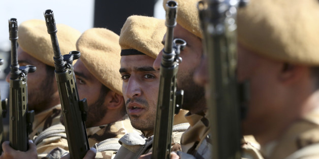 Iranian army troops conclude their march in a military parade marking the 35th anniversary of Iraq's 1980 invasion of Iran, in front of the shrine of late revolutionary founder Ayatollah Khomeini, just outside Tehran, Iran, Tuesday, Sept. 22, 2015. President Hassan Rouhani said Tuesday his countryâs military is the most reliable force to take on âterrorists in the regionâ _ a reference to the extremist Islamic State group while offering help to neighboring nations in case of fight against terrorism. (AP Photo/Vahid Salemi)