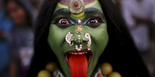 An Indian man dressed as Hindu Goddess Kali participates in a religious procession to mark âRam Navamiâ festival in New Delhi, India, Friday, April 19, 2013. Ram Navami celebrates the birthday of Hindu god Rama. ( (AP Photo/Kevin Frayer)