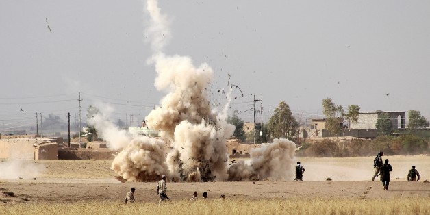 KIRKUK, IRAQ - SEPTEMBER 30 : Smoke rises from minefield in Telelverid region after Peshmerga forces detonated landmines placed by DAESH forces to intervene the passing of Peshmergas during an operation against Daesh terrorists in the outskirts of Kirkuk, Iraq on September 30, 2015. 10 villages rescued from Daesh terrorists. (Photo by Hazar Rashd Hameed/Anadolu Agency/Getty Images)