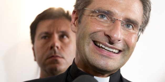 Monsignor Krzysztof Charamsa answers reporters' questions during a press conference in downtown Rome, Saturday Oct. 3, 2015. The Vatican on Saturday fired Charamsa who came out as gay on the eve of a big meeting of the world's bishops to discuss church outreach to gays, divorcees and more traditional Catholic families. (AP Photo/Alessandra Tarantino)