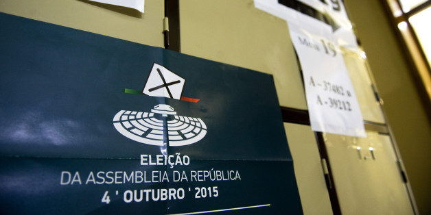 A poster for the national election sits on lockers in a public school used as a polling station during the Portuguese election, in Massama near Lisbon, Portugal, on Sunday, Oct. 4, 2015. Portuguese voters are casting their ballots Sunday in the first general election since 2011, with polls signaling the government that led the nation out of an international bailout may be re-elected. Photographer: Paulo Duarte/Bloomberg via Getty Images