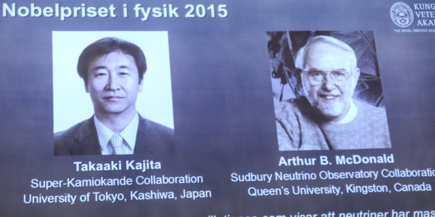 A screen shows the winners as members of the Nobel Assembly announce the winner of the 2015 Nobel Prize in physics, in Stockholm, Tuesday Oct. 6, 2015. Takaaki Kajita of Japan and Arthur McDonald of Canada won the Nobel Prize in physics for the discovery of neutrino oscillations. The Royal Swedish Academy of Sciences said the two researchers had made key contributions to experiments showing that neutrinos change identities. (Fredrik Sandberg/TT via AP) SWEDEN OUT