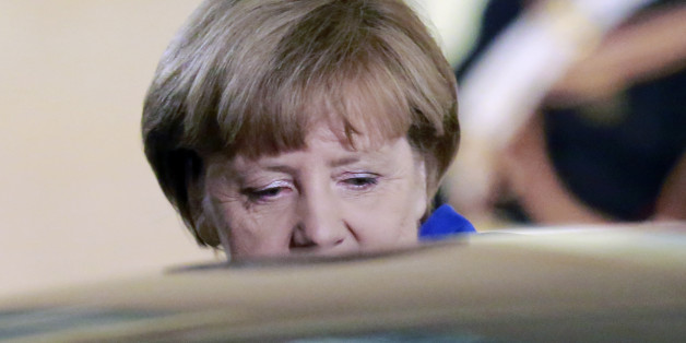 German Chancellor Angela Merkel leaves the Elysee Palace in Paris, France, after a a joint press conference with French President Francois Hollande, Friday, Oct. 2 , 2015. Merkel was in Paris with the leaders of Ukraine, France and Russia in a revived European push to bring peace to eastern Ukraine.The long-awaited summit in Paris on Friday was being overshadowed by international concerns about Russiaâs military intervention in Syria this week. (AP Photo/Jacques Brinon)