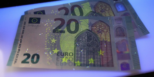 New 20 Euro notes are seen in Frankfurt am Main, western Germany, on March 4, 2015. According to the German Central Bank Bundesbank, the new banknote containing an additional innovative security feature, the portrait window in the hologram, will be issued for retailers and consumers on November 25, 2015. AFP PHOTO / DANIEL ROLAND (Photo credit should read DANIEL ROLAND/AFP/Getty Images)