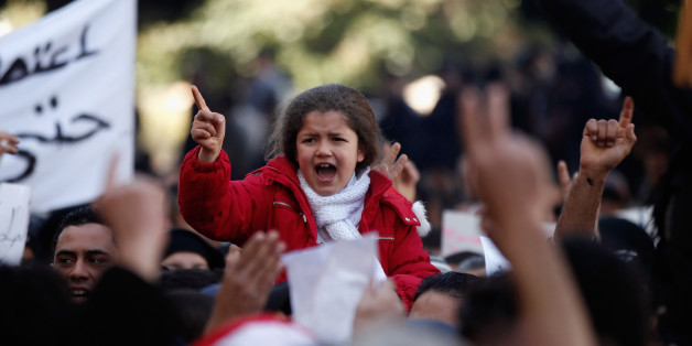 Protestors supporting the government and opposed to strikes demonstrate in Tunis, Tuesday Jan. 25, 2011. Tunisia's so-called "Jasmine Revolution" has sparked scattered protests and civil disobedience in the Middle East and North Africa, and much of the world is watching to see how the birth pangs of Tunisian democracy play out. Poster reads: No to the violence. (AP Photo/Hassene Dridi)