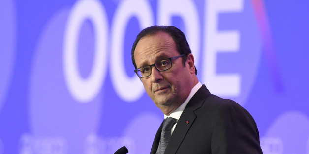 French President François Hollande delivers remarks on "Investment and Climate" during the OECD Ministerial Council meeting at the OECD headquarters in Paris, France, Wednesday, June 3, 2015. The world economy risks being bogged down in a low growth spiral unless measures are taken to spur demand and incite businesses to boost their stubbornly sluggish investments. That's the conclusion of the latest economic forecast from the Organization for Economic Cooperation and Development, the Paris-based body made up of 34 of the world's most developed countries. (Alain Jocard/Pool Photo via AP)