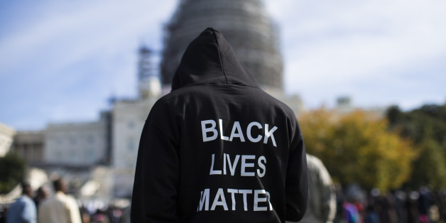Neal Blair, of Augusta, Ga., wears a hoodie which reads, "Black Lives Matter" as stands on the lawn of the Capitol building during a rally to mark the 20th anniversary of the Million Man March, on Capitol Hill, on Saturday, Oct. 10, 2015, in Washington. Black men from around the nation returned to the capital calling for changes in policing and in black communities. (AP Photo/Evan Vucci)