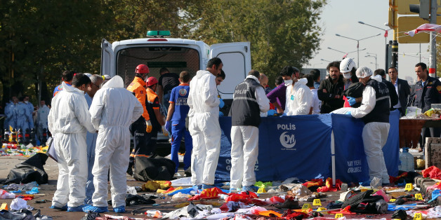 Rescue workers and police forensic officers inspect the site of an explosion in Ankara, Turkey, Saturday, Oct. 10, 2015. Two nearly simultaneous explosions targeted a Turkish peace rally Saturday by Kurdish activists and opposition supporters in Ankara. At least 86 people were killed and nearly 190 wounded in what appeared to be suicide attacks, Turkish officials said. The explosions occurred seconds apart outside the capitalâs main train station as hundreds gathered for the rally, organize