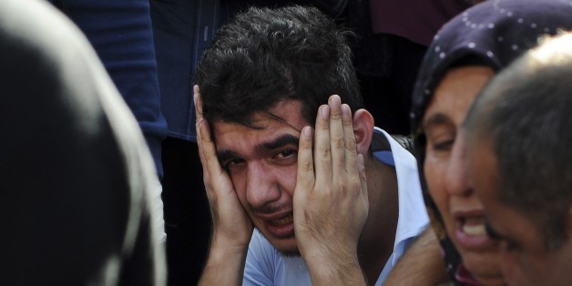 Relatives of people wounded at the explosions in Ankara, Turkey, react as they wait news for their loved ones outside a hospital, Saturday, Oct. 10, 2015. Two bomb explosions targeted a peace rally, organised by the country's public sector workers' trade union, in the Turkish capital killing dozens of people and injuring scores of others. The rally aimed to call for an end to the renewed violence between Kurdish rebels and Turkish security forces. (Depo Photos via AP) TURKEY OUT