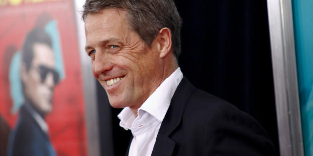 Hugh Grant attends the premiere of "The Man From U.N.C.L.E." at the Ziegfeld Theatre on Monday, Aug. 10, 2015, in New York. (Photo by Andy Kropa/Invision/AP)